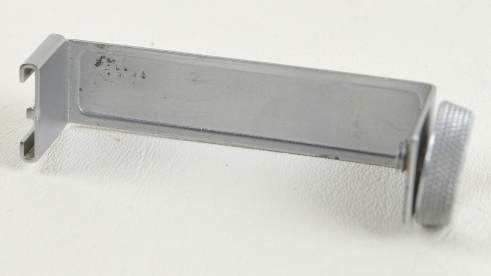 Olympus Pen (EE, D) accessory/flash shoe bracket.