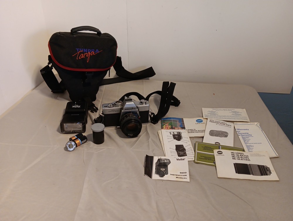 Minolta SRT 200 camera. With Accessories And Paperwork. Untested.