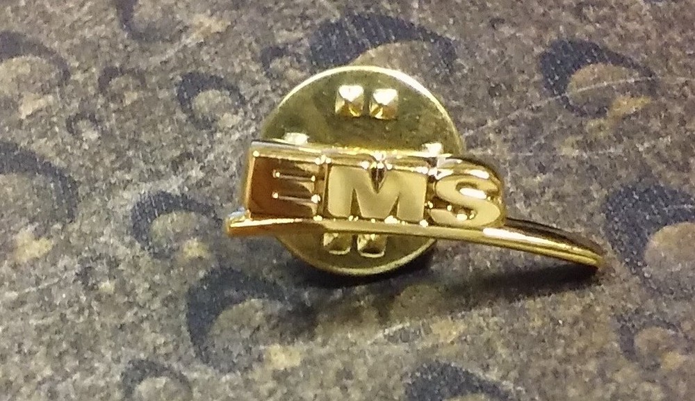 Goldtone EMS pin badge