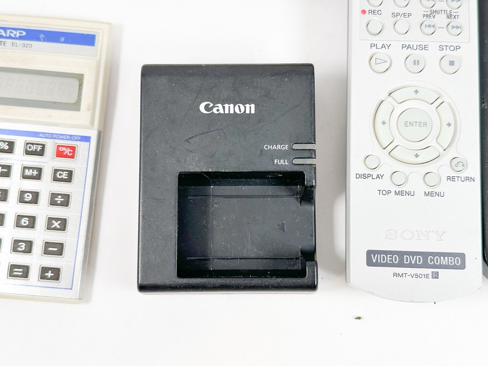 Mixed Electronics Lot TV Remotes Camera Calculators Vintage