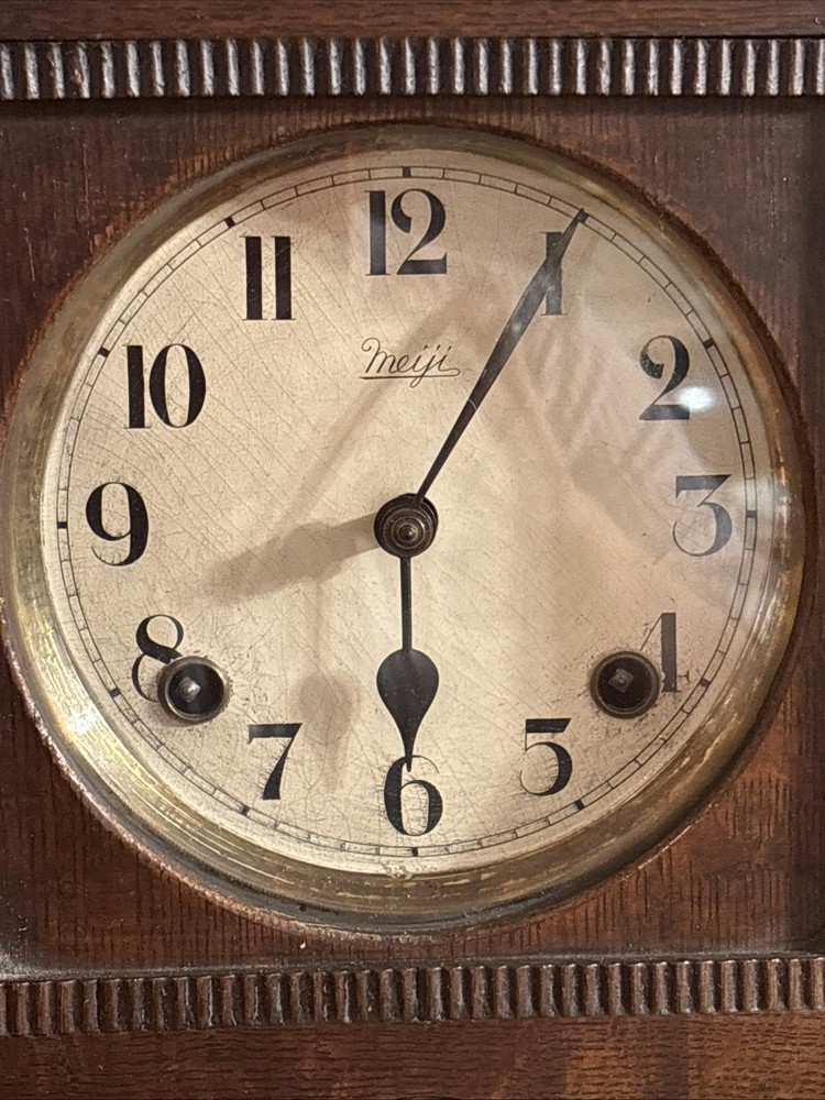 Vintage spring pendulum clock made by Meiji Clock Co.
