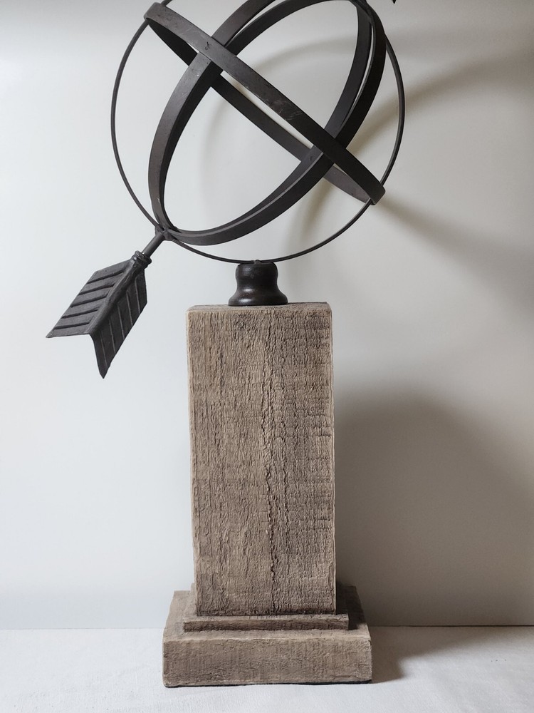 Metal Orb And Arrow Decor On Standing Base