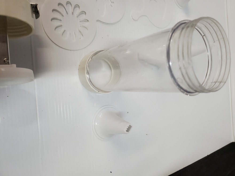 White plastic Cookie Press Disc Cutouts -with extras