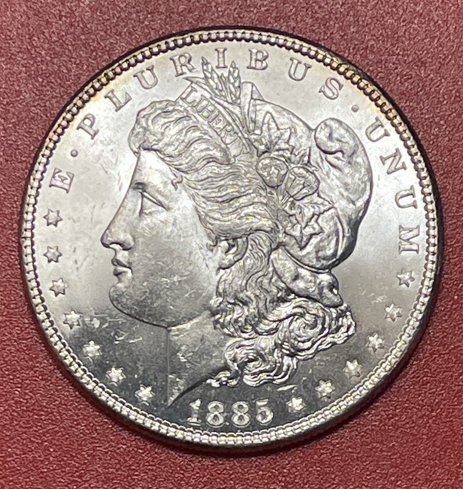 1885 P Morgan Silver Dollar, Choice to Gem Uncirculated.