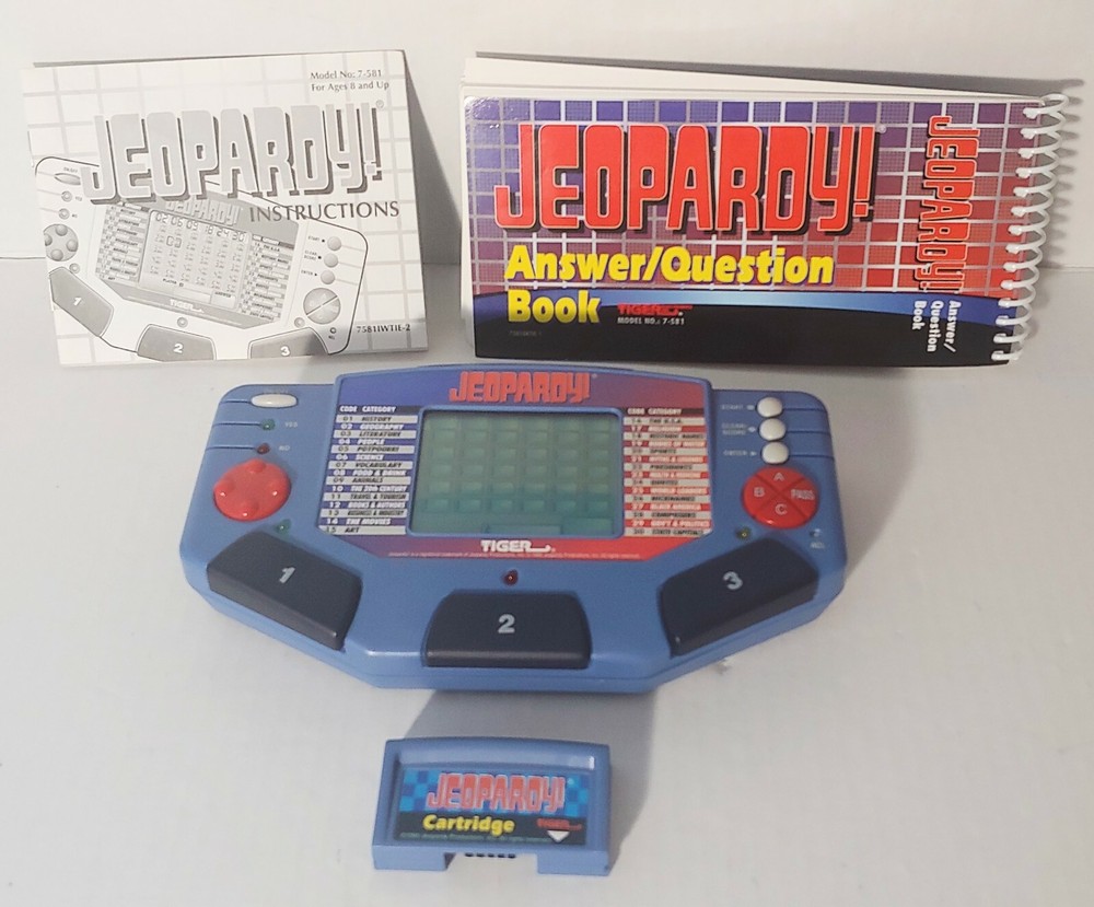 Jeopardy Handheld Electronic Game Complete with Answer/Question Book & Cartridge