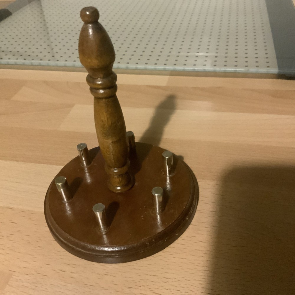 8 thimbles plus a wooden stand