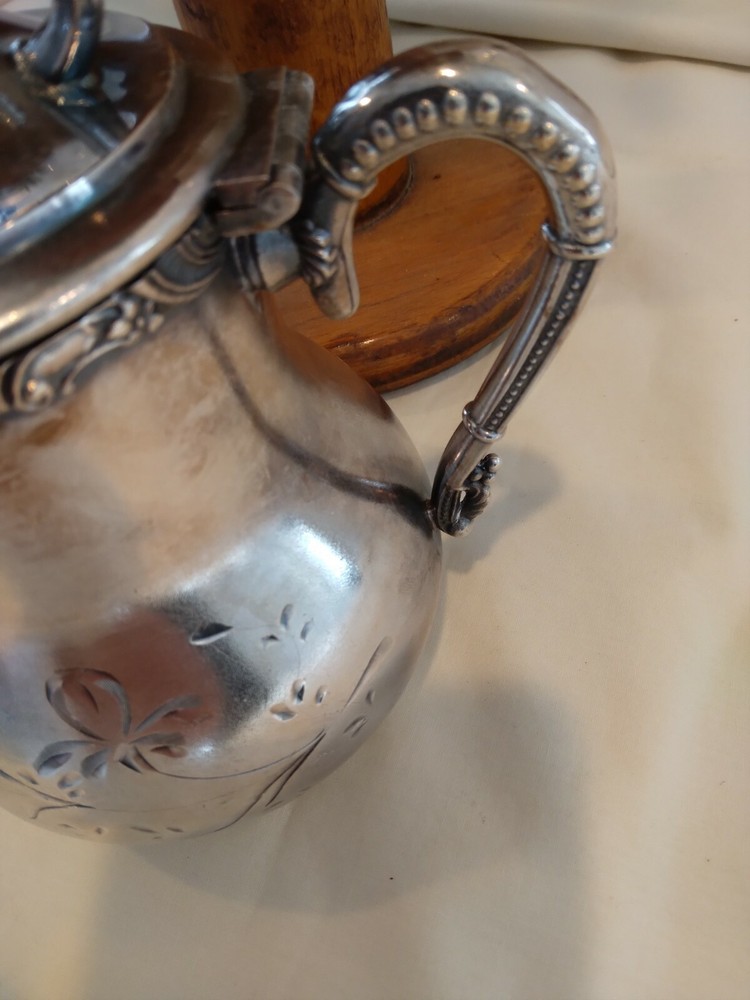 Beautiful small antique silver plated or silver pitcher.