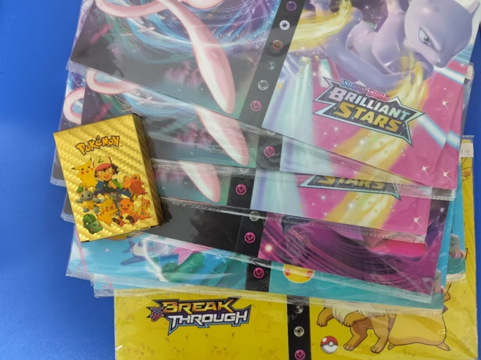 55 randomized Pokémon cards + booklet with 120 cards 4 cards per page New!