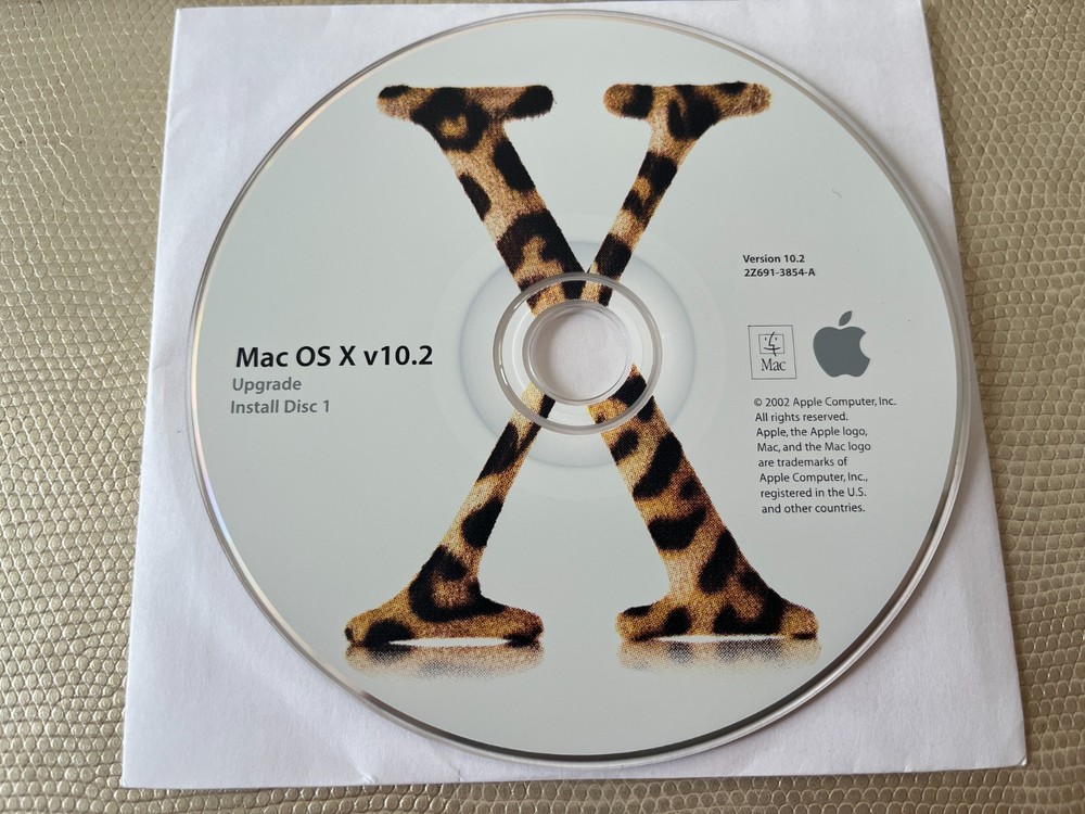 Mac OS X 10.2 Jaguar install discs + developer tools disc and Mac OS X manual