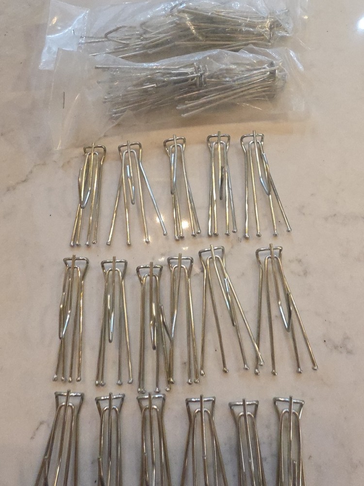 14 curtain hooks 4 prongs with extra hook on bottom.