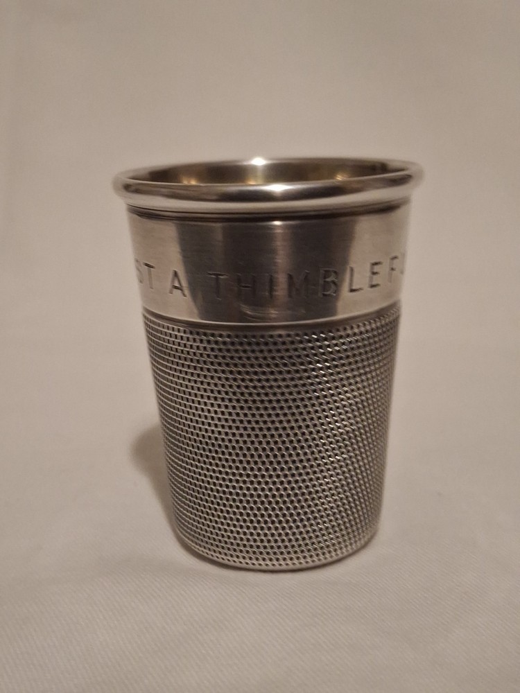 Sterling silver, shot jigger shape like oversized thimble.