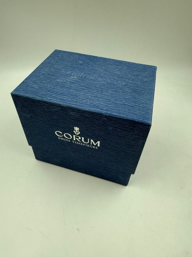 Original Corum Box with booklet and filled card