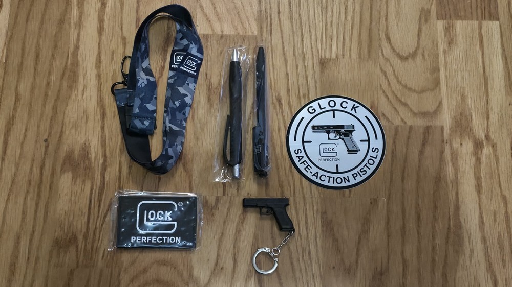 Glock Swag Includes Sticker, Patch, Lanyard, Keychain, 2 Different Pens.