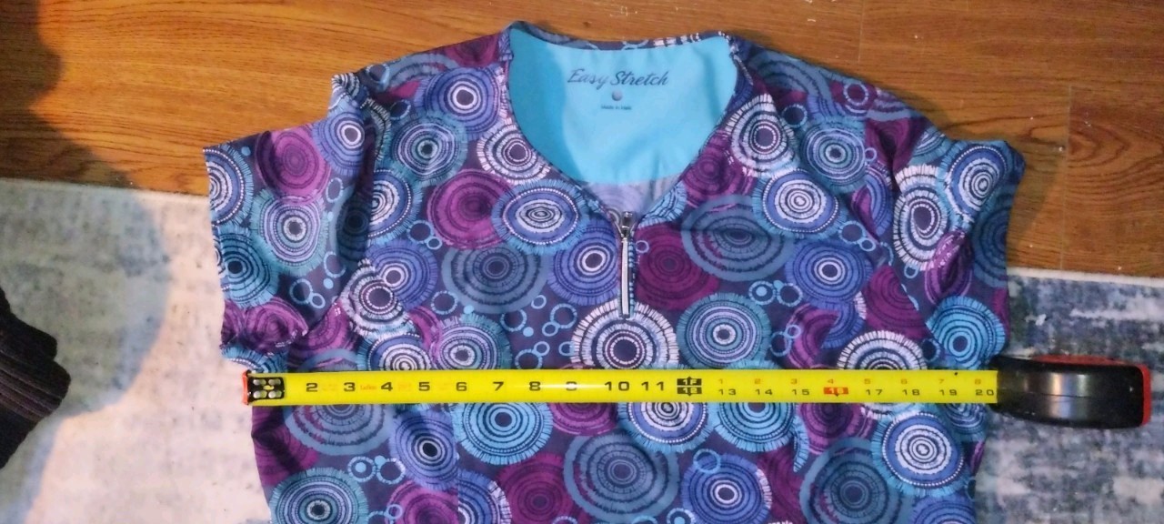 SET OF 2SCRUB TOPS AND MATCHING PANTS FOR BOTH IN MED.