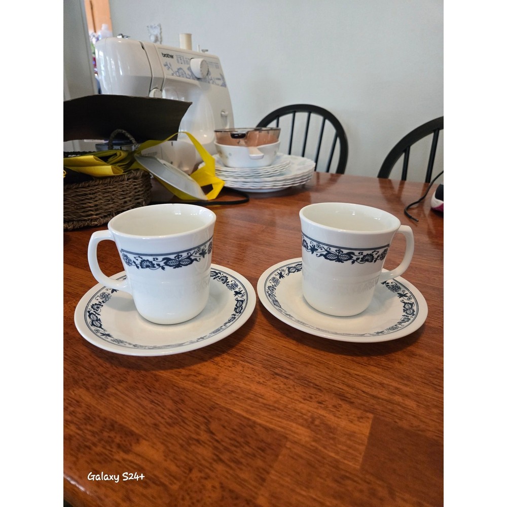 Corelle olde time pattern cups and saucers. 2 each.
