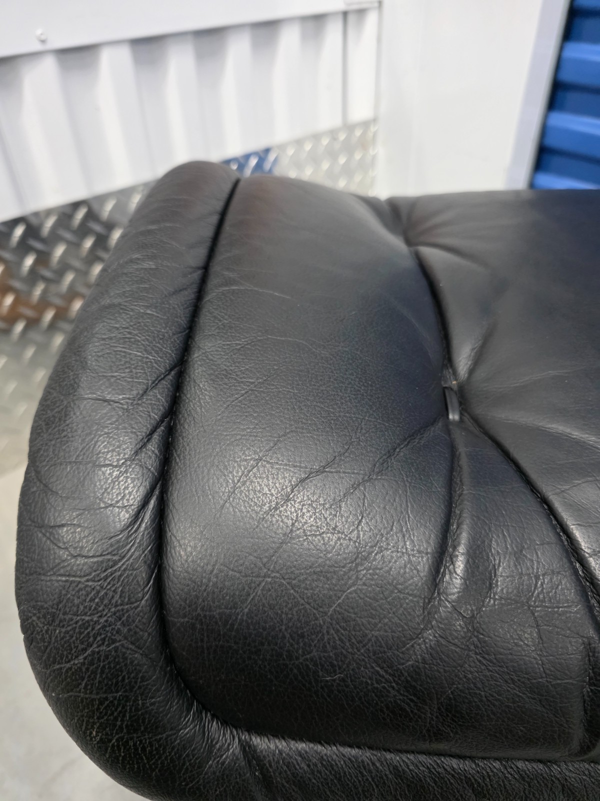 Ekornes Stressless Black Colored Leather Ottoman | Teak Stained Wood Base