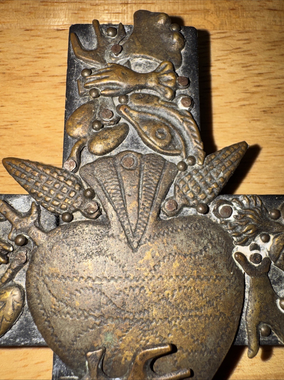 Vintage handmade folk art cross with 35+ brass milagros signed Gonzalez 1993