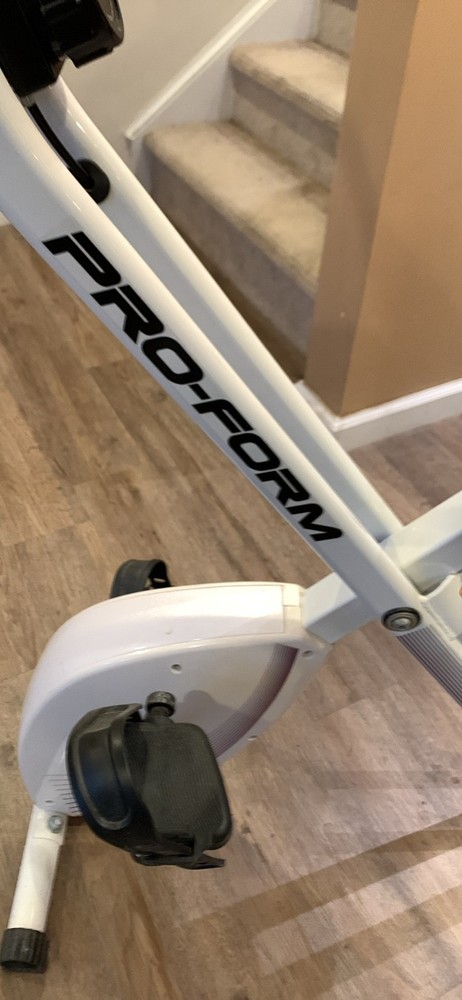 pro-form white foldable stationary exercise peddling bike