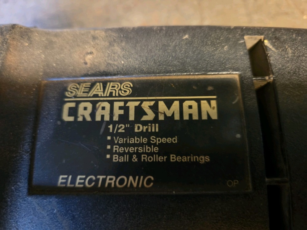 Sears Craftsman 1/2 Inch Reversible Variable Speed Drill with side handle.