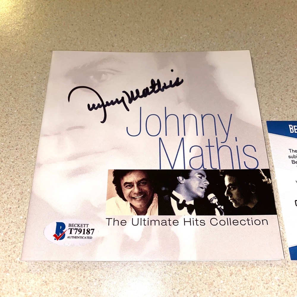 JOHNNY MATHIS autographed signed ULTIMATE HITS CD BOOKLET BECKETT BAS COA