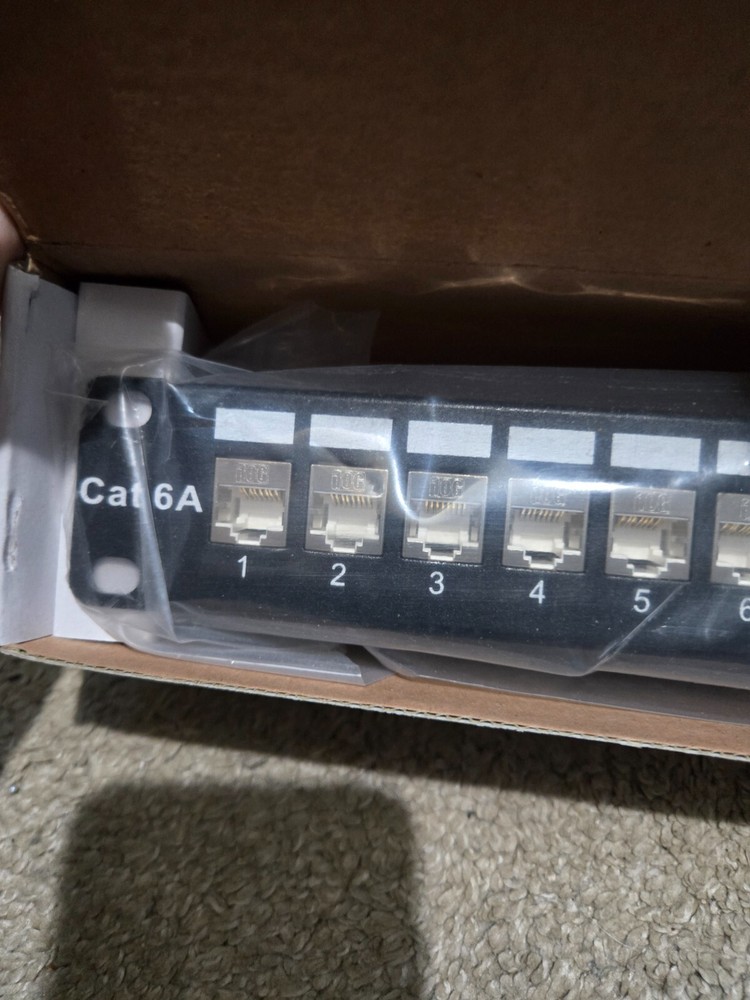 TrippLite Shielded Cat6A Rackmount Feed Through Patch Panel Model N254-024-SH-6A