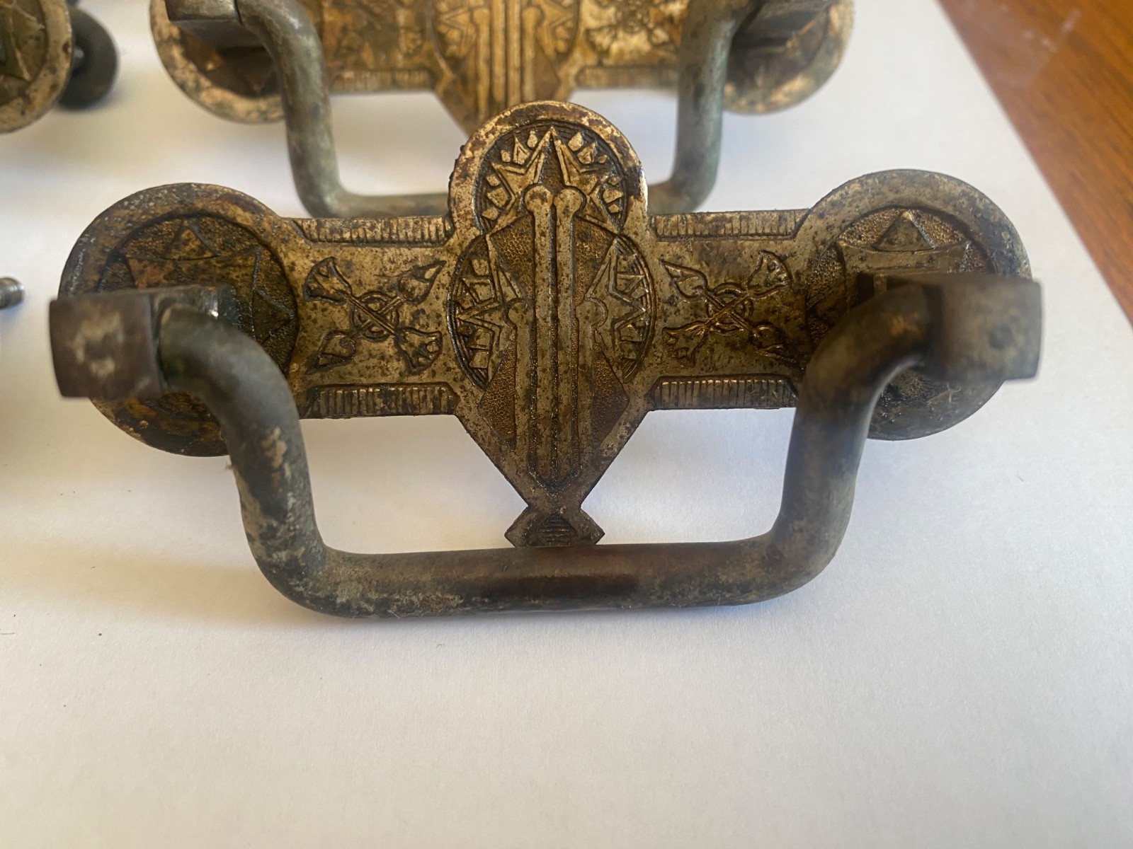 Eight- 2.5' center original brass Eastlake drawer pulls. Salvaged -not cleaned