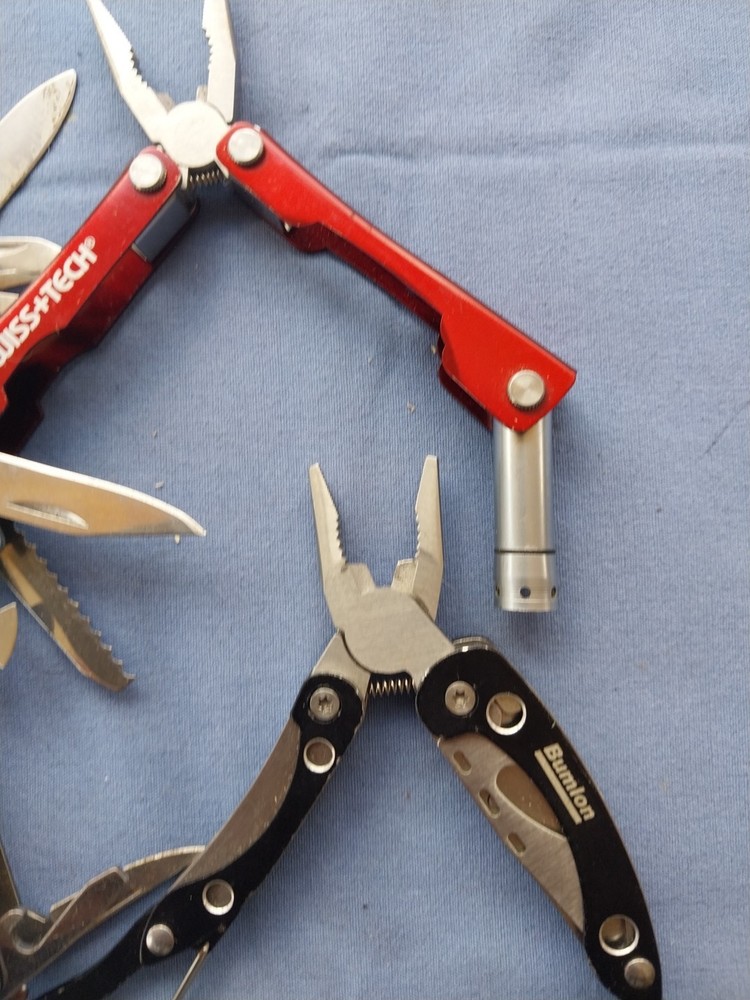 4 small multitudes with pliers knife scissors screwdriver's
