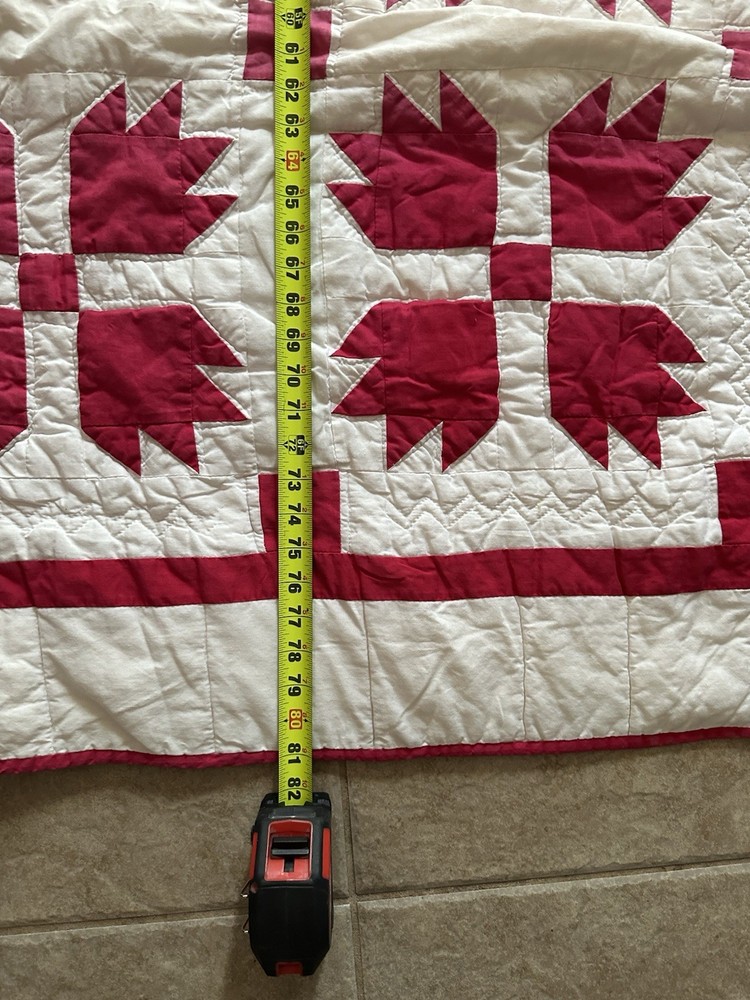 Cutters handmade red and white "Bear Paw" pattern quilt.