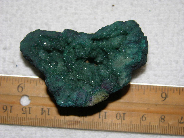 Geode cut & polished half with colored crystal center 2.5 inch E33