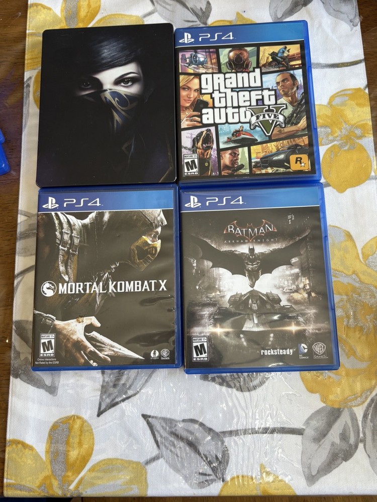 Sony PlayStation 4 1TB Bundle with Controller, Cords, and Games
