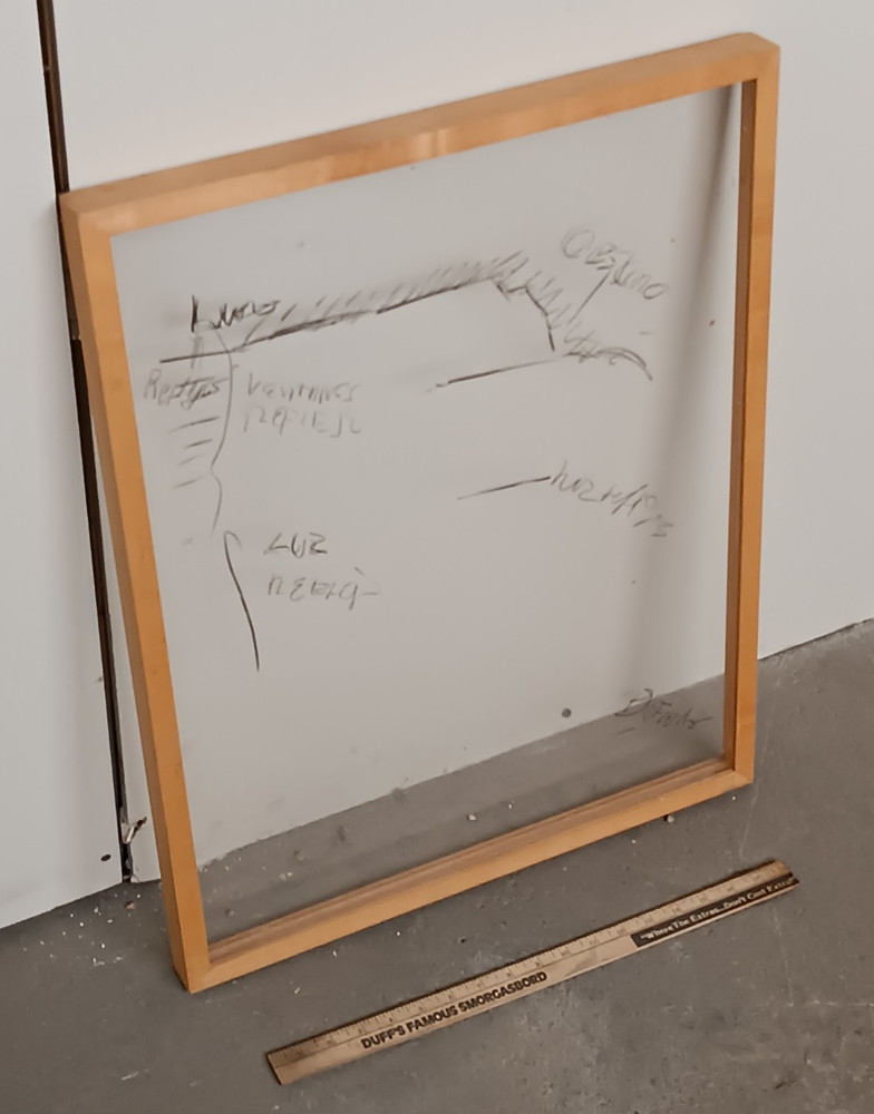 Framed glass with dooodle scribble notes abstract outsider art office planning