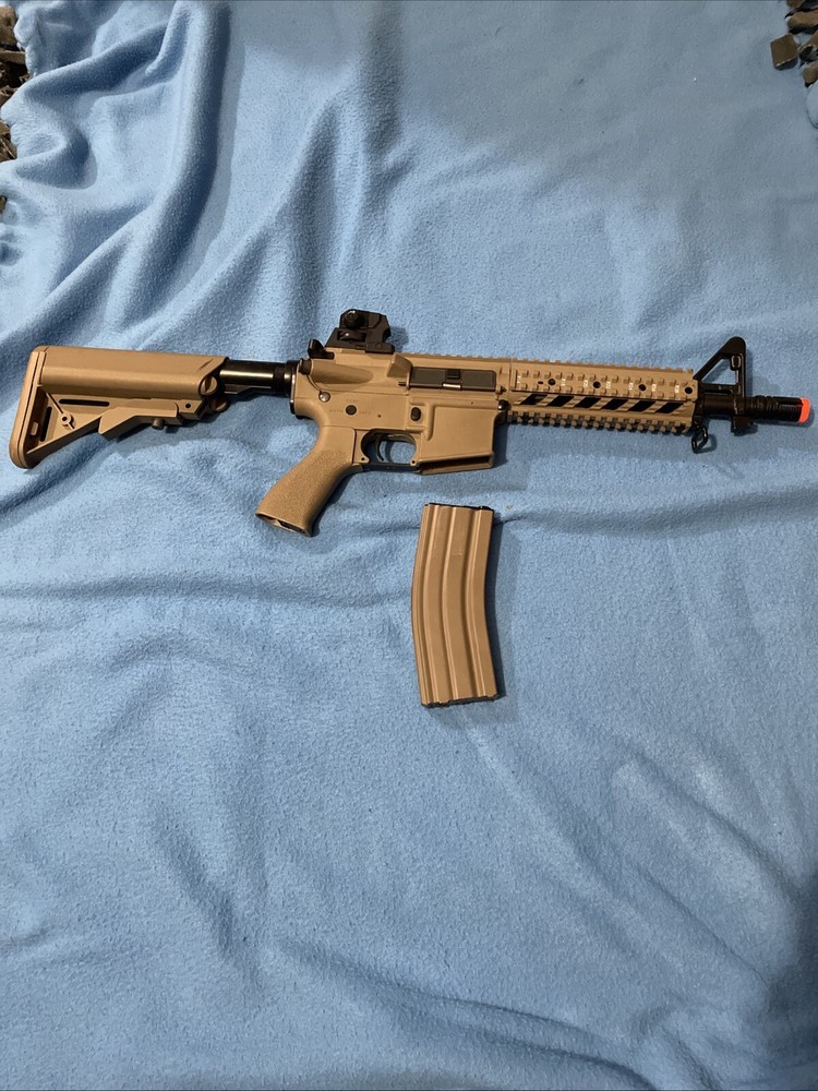 A. E. G. Combat Machine Airsoft Gun (w/ Mid Cap Magazine)