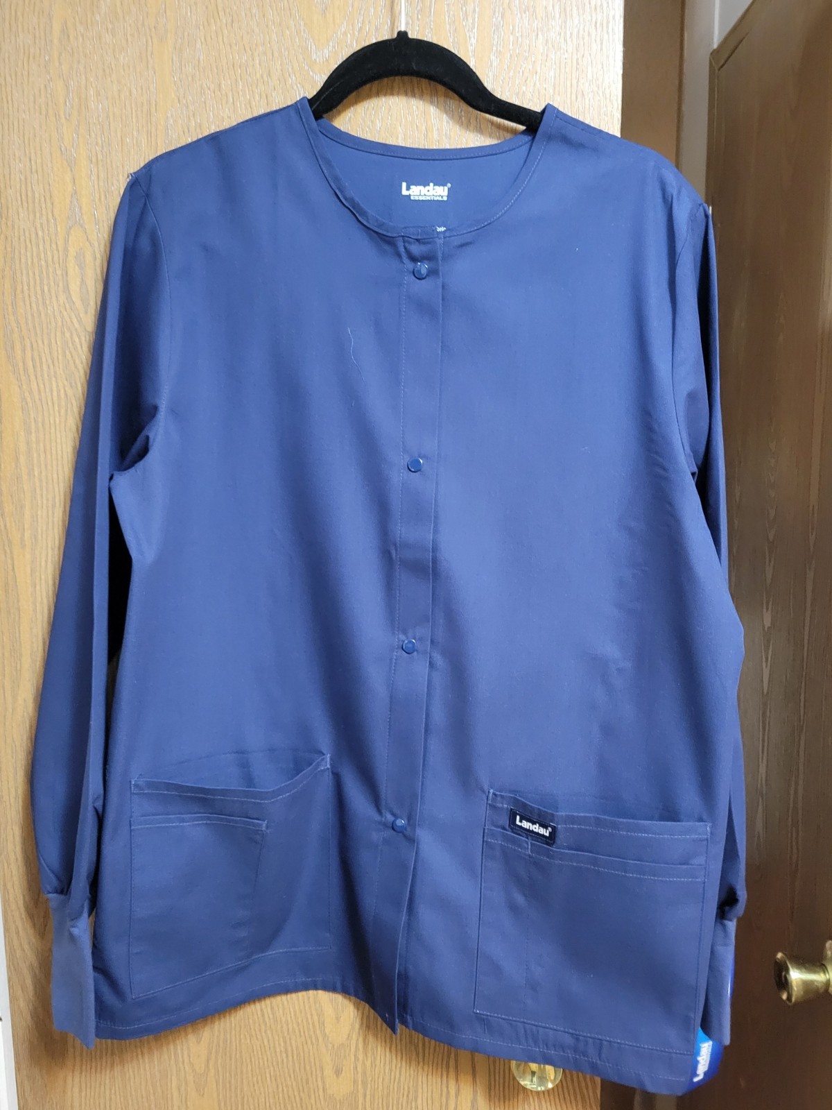 NWT. Med Unisex Long Sleeve Scrub Top/Jacket By Landau. Measurements Posted.