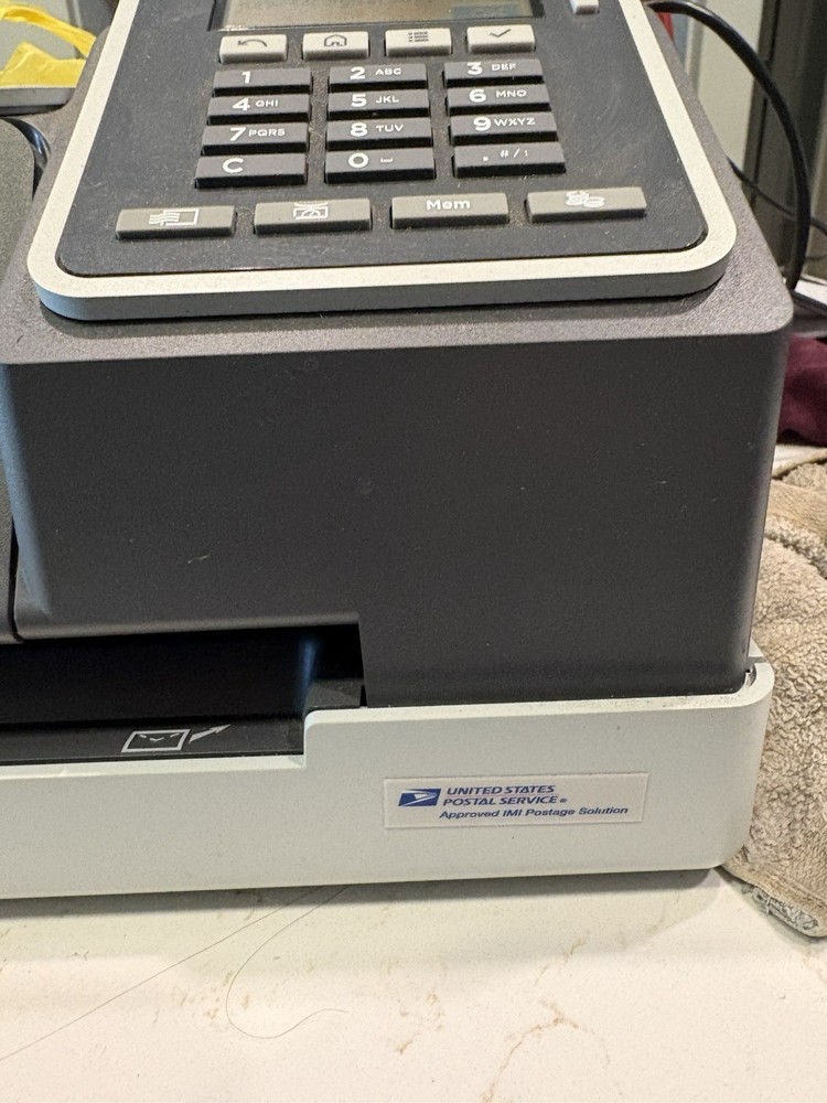 Quadient IX-1 Series Postage Printer.