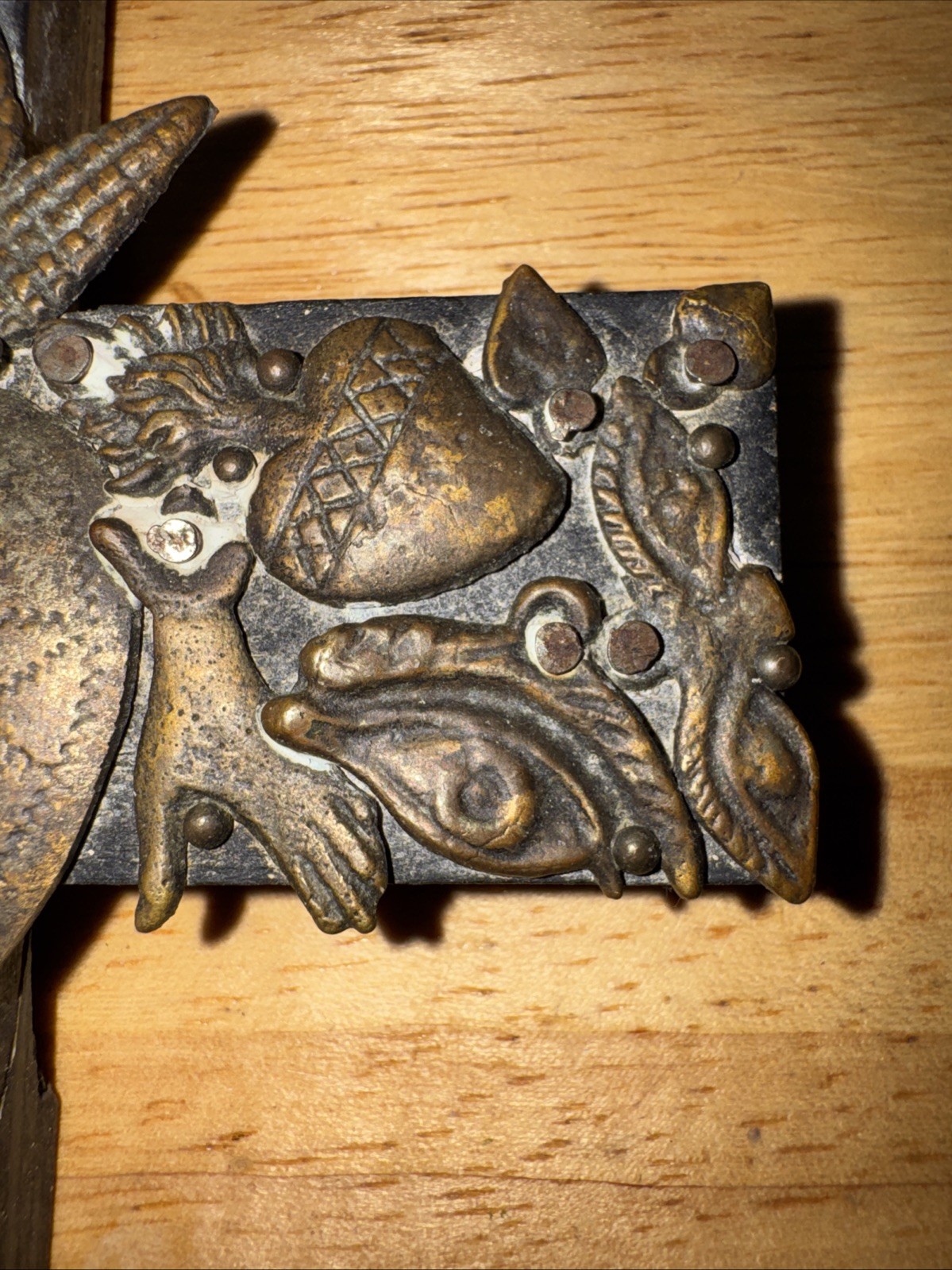 Vintage handmade folk art cross with 35+ brass milagros signed Gonzalez 1993