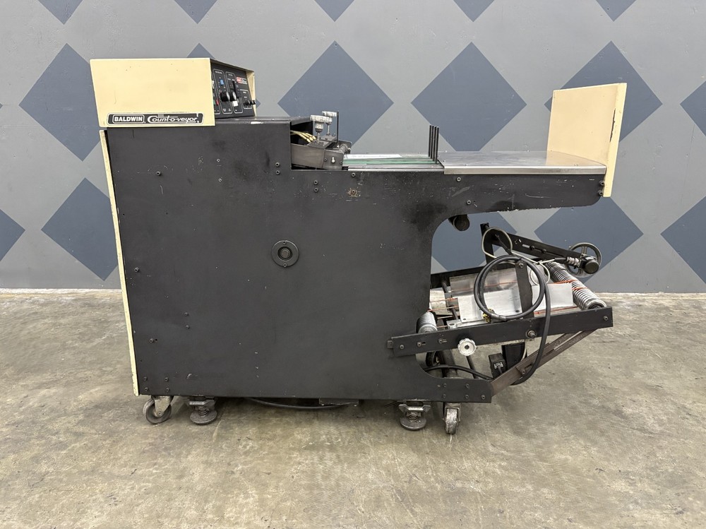 One (1) Short Baldwin Count-O-Veyor Model 110