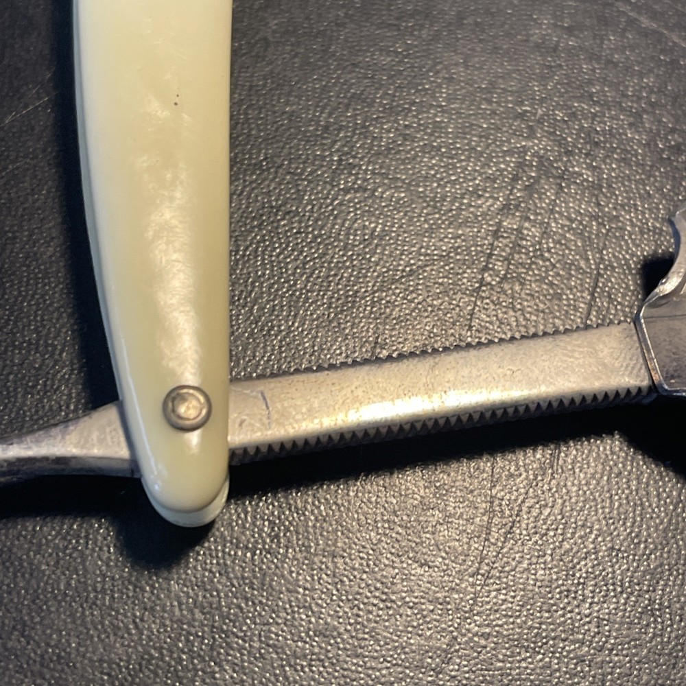 Two vintage straight razors