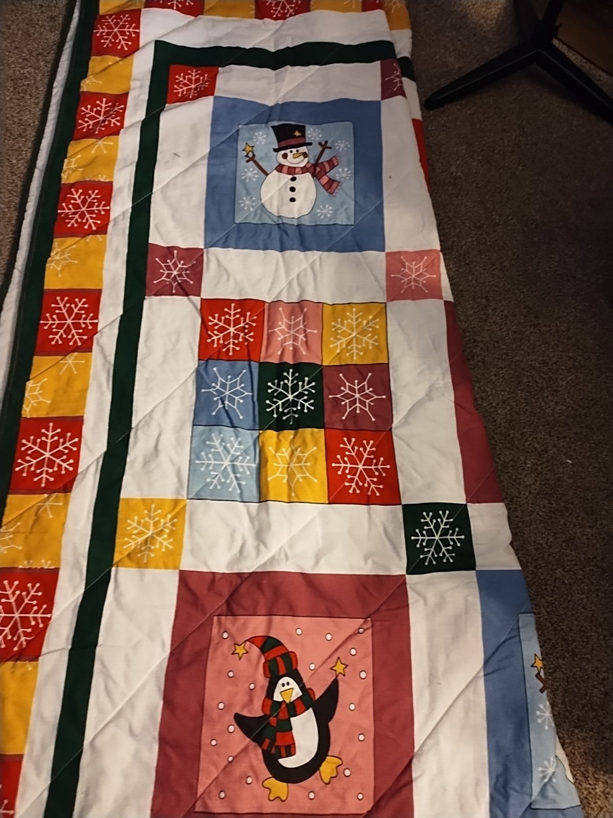 quilt featuring a winter scene with a snowman, reindeer, and penguin Q/F
