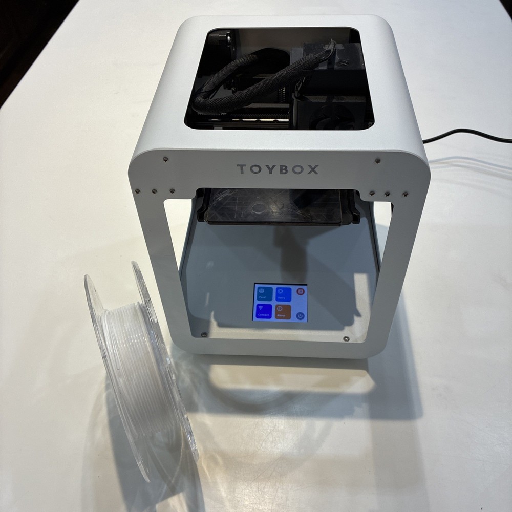 TOYBOX 3D Printer with white printer food.