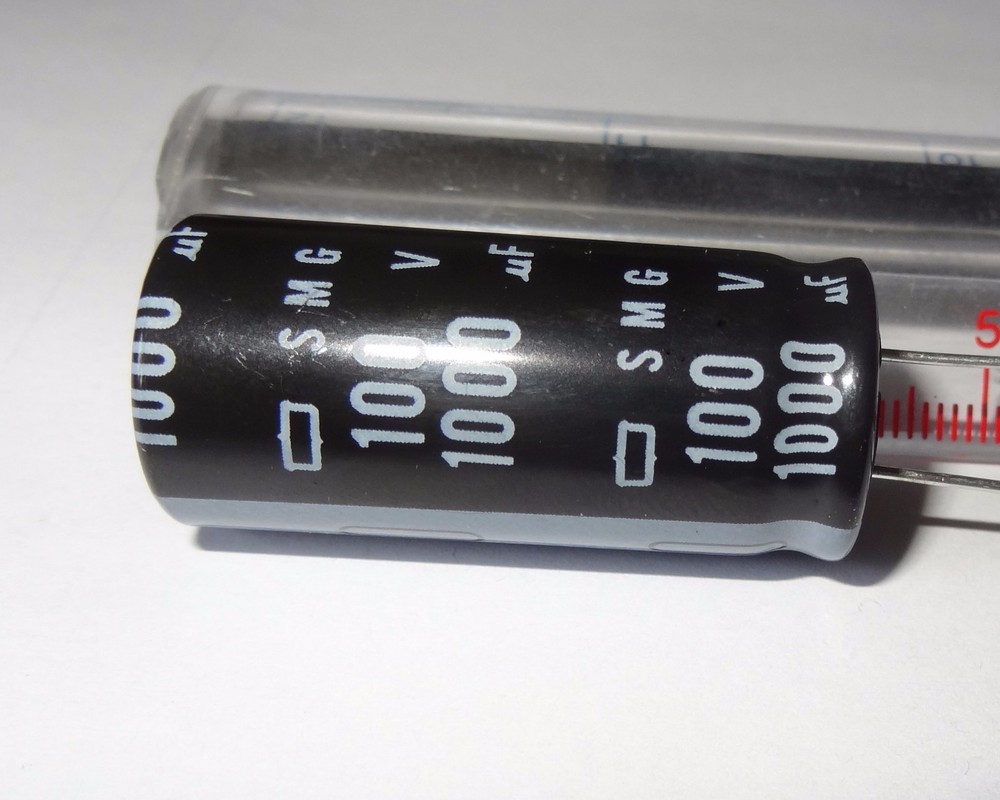 1 pc, 1000uF, 100V electrolytic capacitor. 2G4