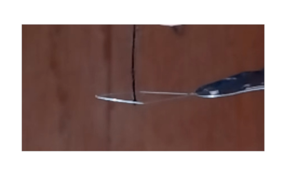 Two Flimsy Needle Threaders. Helps you thread a needle.