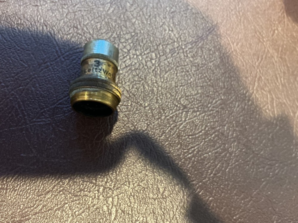 ERNST LEITZ MICROSCOPE WITH 3 OBJECTIVES AND CASE.