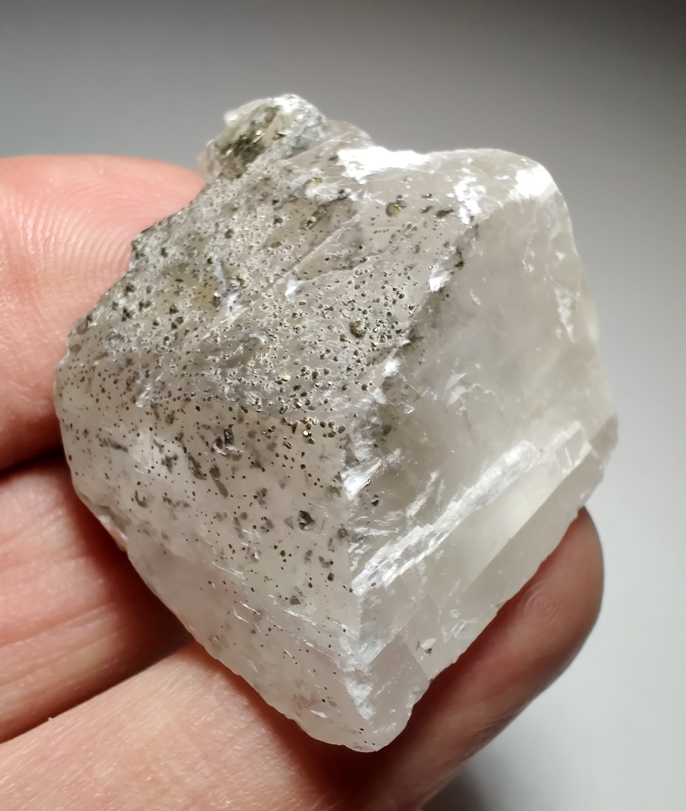 Calcite crystal with Pyrite crystals, fluorescent. Klein Quarry, Iowa. 45 grams.