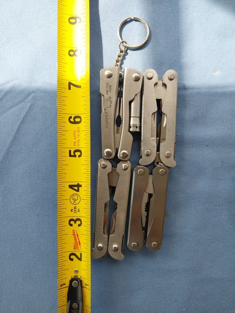 4 small multitudes with pliers knife scissors screwdriver's
