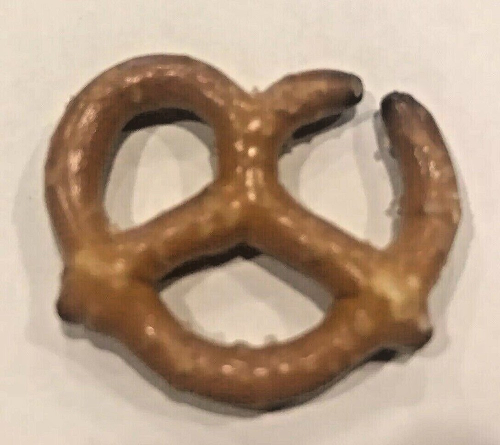 ERROR PRETZEL OPENING WAS LIKELY BURNED WHEN ORIGINALLY MADE