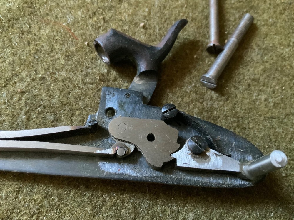 Percussion lock with screws