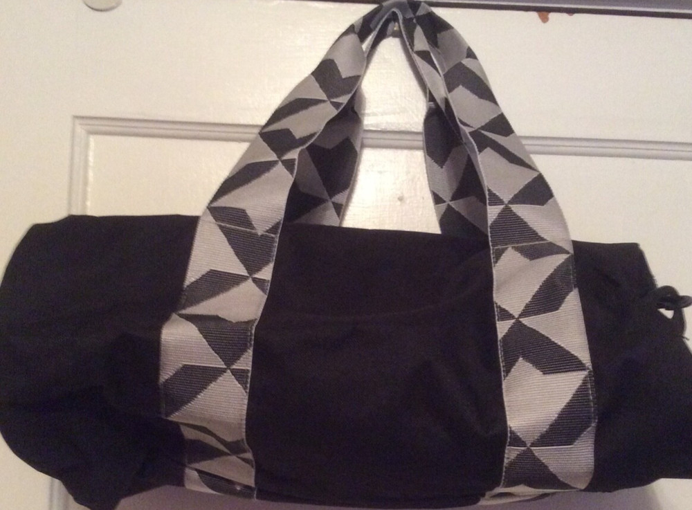 Twelve NYC black Duffel bag.  Adjustable shoulder strap.