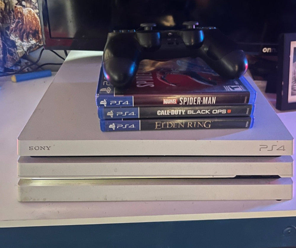 ps4 console pro with controller and games