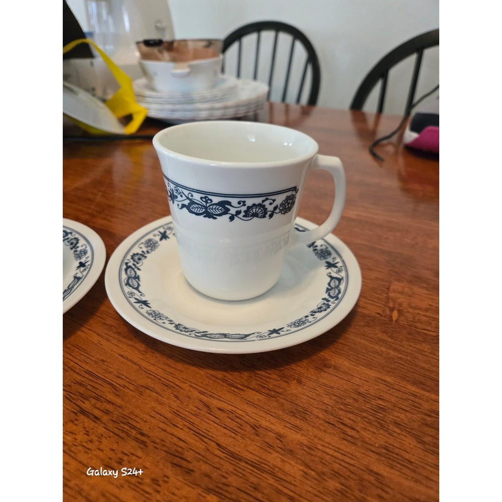 Corelle olde time pattern cups and saucers. 2 each.