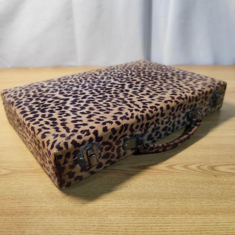 Mahjong tile set in leopard print case